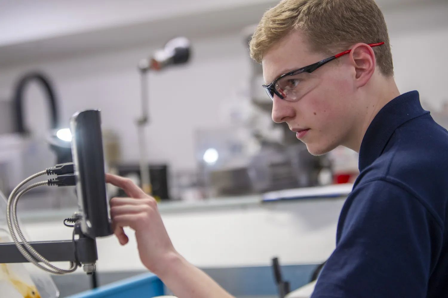 engineering student using machinery