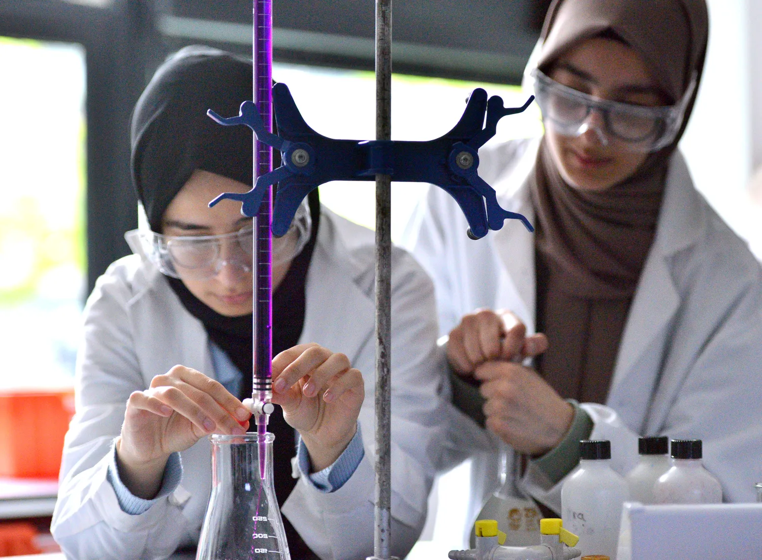 two female science students with their aparatus