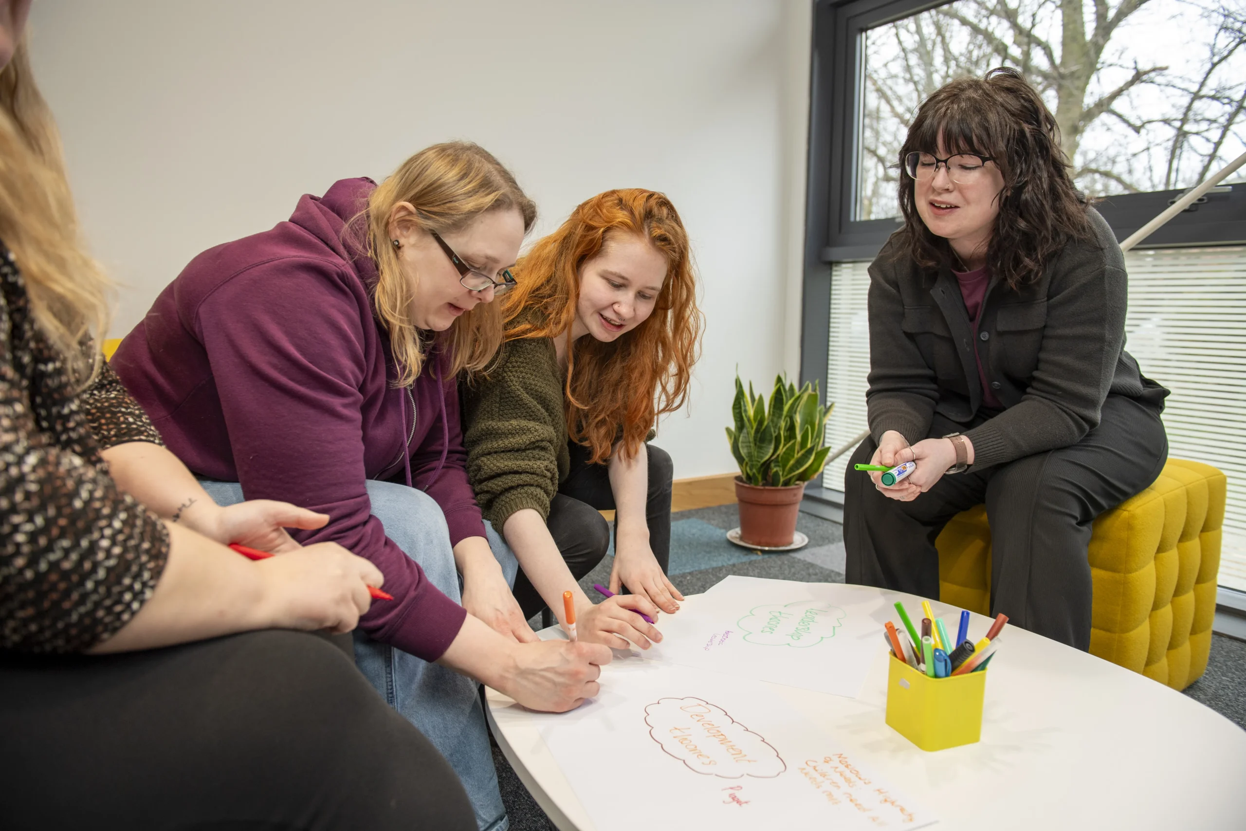 Students talking around a table