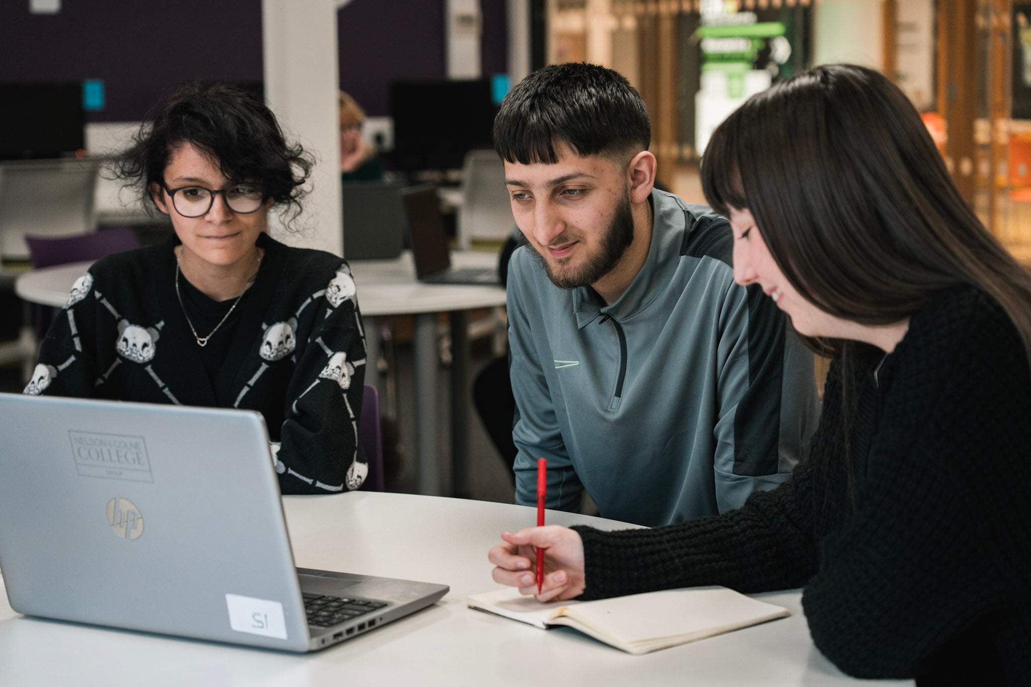 Students talking around a table
