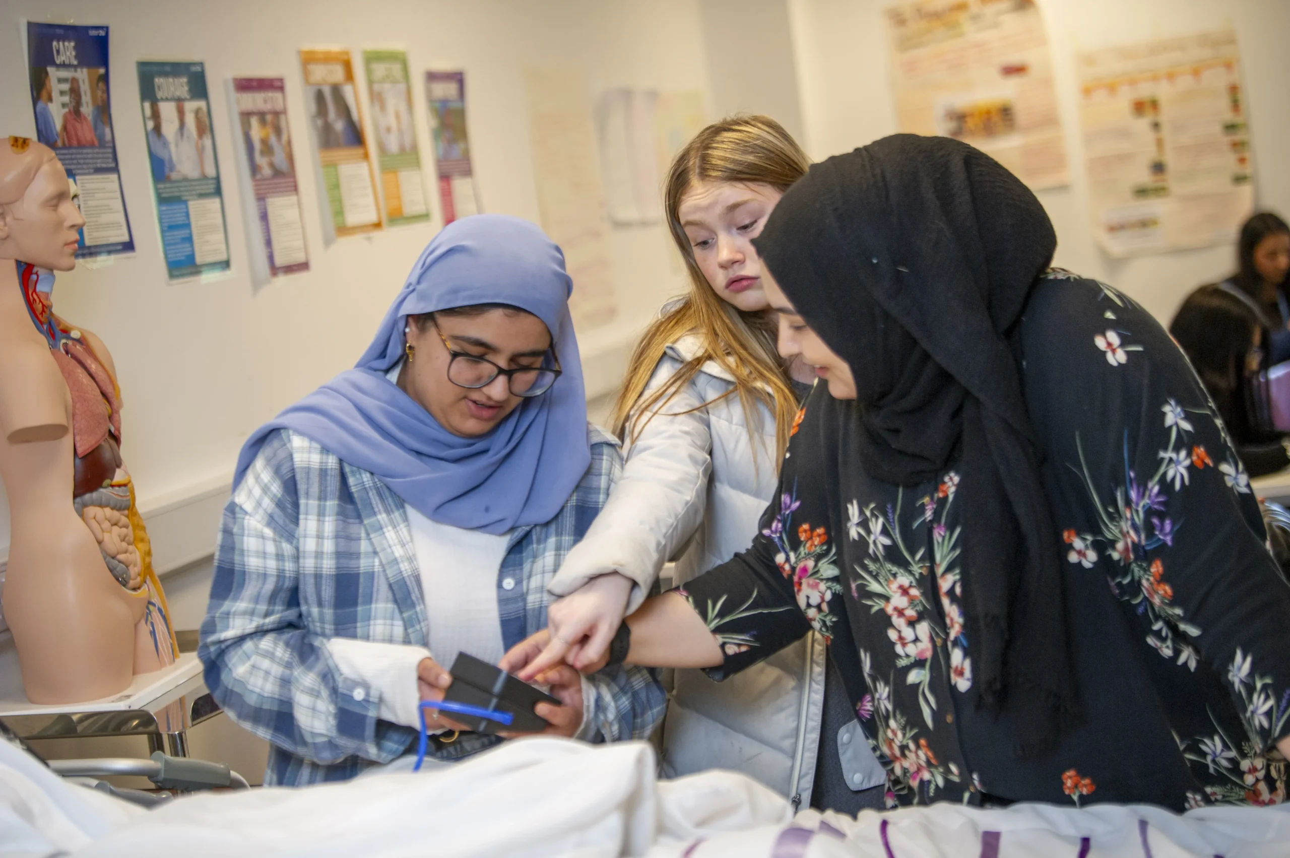 Three students discussing work